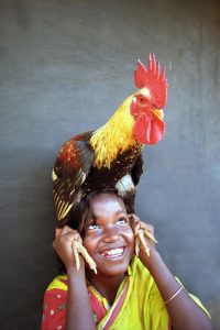 Child with chicken (Source: Nimai Chandra Ghosh/Photoshare)